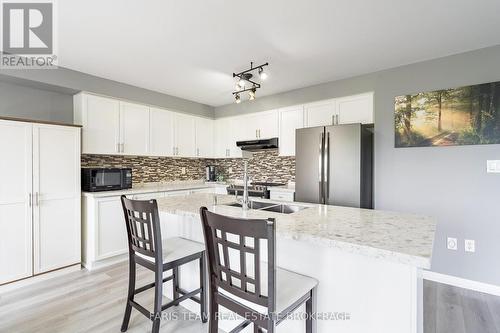 64 John W Taylor Avenue, New Tecumseth, ON - Indoor Photo Showing Kitchen With Double Sink With Upgraded Kitchen
