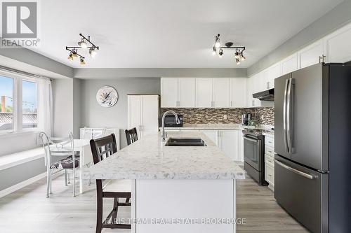 64 John W Taylor Avenue, New Tecumseth, ON - Indoor Photo Showing Kitchen With Double Sink With Upgraded Kitchen