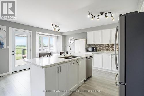 64 John W Taylor Avenue, New Tecumseth, ON - Indoor Photo Showing Kitchen With Double Sink