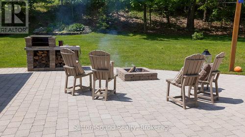 Stone Patio behind Primary Res - 505556 Grey Road 1 Road, Georgian Bluffs, ON - Outdoor With Deck Patio Veranda