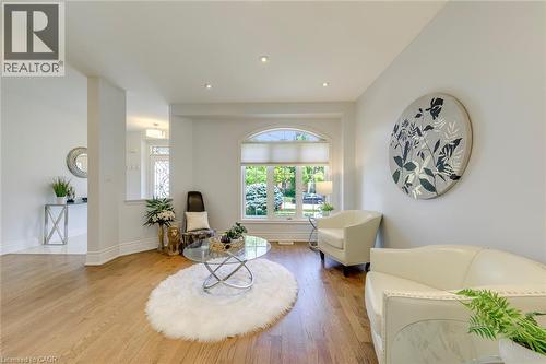 Spacious living area featuring wood-finish flooring and recessed lighting - 2380 Woodcrest Drive, Oakville, ON - Indoor Photo Showing Living Room