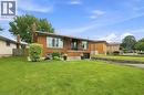 Brick exterior featuring a front balcony with black railing, integrated garage, and a large front lawn - 15 Quay Court, Hamilton, ON  - Outdoor 