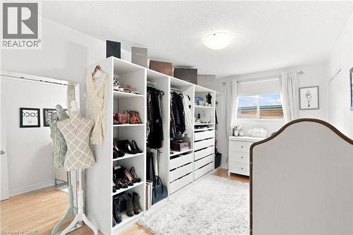 Customizable built-in closet system with shelving and drawer storage - 15 Quay Court, Hamilton, ON - Indoor Photo Showing Laundry Room