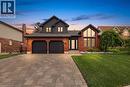 Brick and siding exterior featuring a prominent gabled roofline - 10 Rolling Acres Drive, Kitchener, ON  - Outdoor 