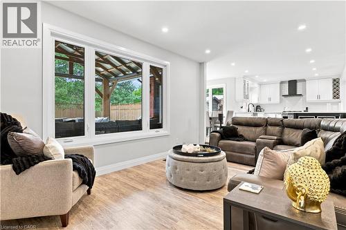 Bright living area featuring wood-finish flooring and recessed lighting - 10 Rolling Acres Drive, Kitchener, ON - Indoor Photo Showing Living Room