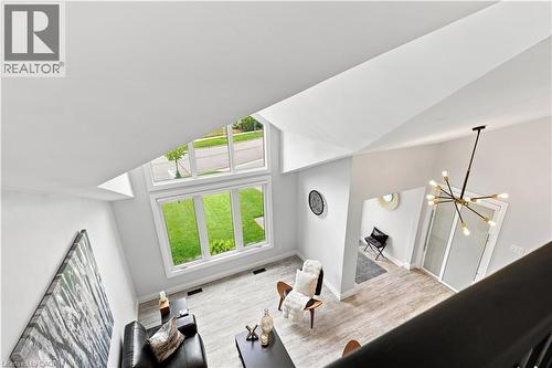 Lofty interior space featuring high vaulted ceilings and abundant natural light from tall windows - 10 Rolling Acres Drive, Kitchener, ON - Indoor Photo Showing Other Room