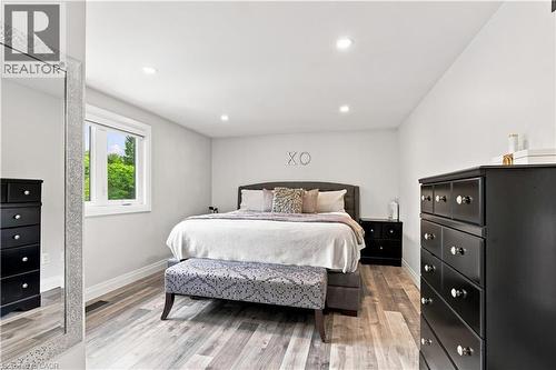 Spacious interior featuring wood-finish flooring, recessed lighting, and a neutral wall palette - 10 Rolling Acres Drive, Kitchener, ON - Indoor Photo Showing Bedroom