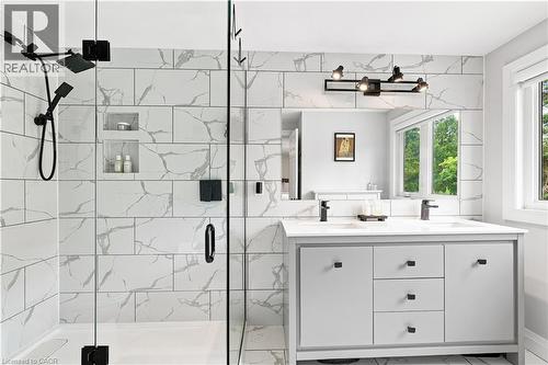 Contemporary bathroom featuring a dual vanity with a white countertop and matte black fixtures - 10 Rolling Acres Drive, Kitchener, ON - Indoor Photo Showing Bathroom