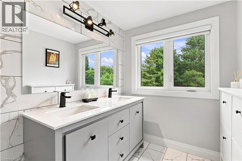 Dual vanity with integrated sinks, quartz countertop, and matte black fixtures - 10 Rolling Acres Drive, Kitchener, ON - Indoor