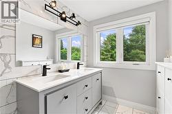 Dual vanity with integrated sinks, quartz countertop, and matte black fixtures - 