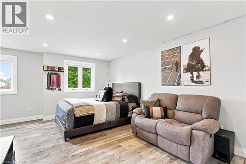 Spacious room featuring light-colored walls and wood-finish flooring - 10 Rolling Acres Drive, Kitchener, ON - Indoor Photo Showing Bedroom