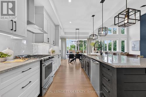 Designer-inspired kitchen layout w SS appliances - 10 B Brigade Avenue, Ottawa, ON - Indoor Photo Showing Kitchen With Upgraded Kitchen