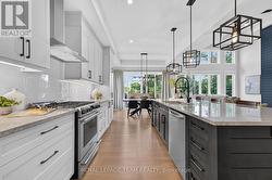 Designer-inspired kitchen layout w SS appliances - 