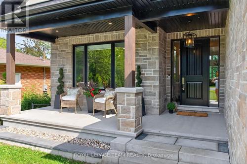 Covered balcony w pot lights & security camera - 10 B Brigade Avenue, Ottawa, ON - Outdoor With Deck Patio Veranda