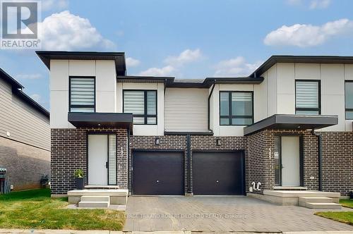 Contemporary chic end unit townhome with garage - 107 - 175 Doan Drive, Middlesex Centre (Kilworth), ON - Outdoor