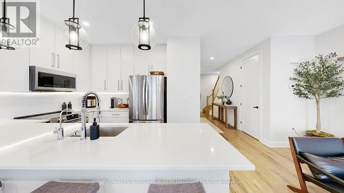 107 - 175 Doan Drive, Middlesex Centre (Kilworth), ON - Indoor Photo Showing Kitchen With Stainless Steel Kitchen With Double Sink With Upgraded Kitchen