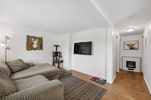 Dwelling - 215  - 217 Ch. Paquette, Mont-Tremblant, QC - Indoor Photo Showing Living Room With Fireplace