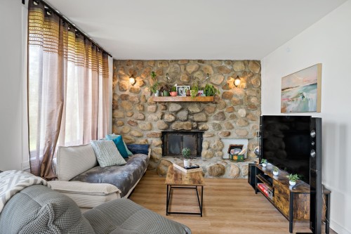 Dwelling - 215  - 217 Ch. Paquette, Mont-Tremblant, QC - Indoor Photo Showing Living Room With Fireplace