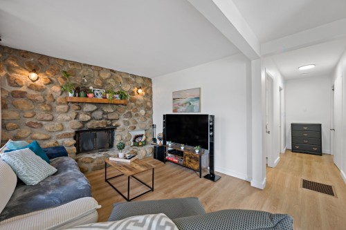 Dwelling - 215  - 217 Ch. Paquette, Mont-Tremblant, QC - Indoor Photo Showing Living Room With Fireplace