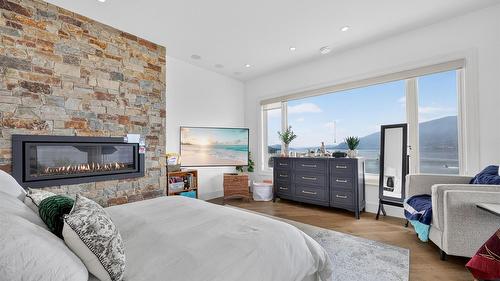 1610 Granite Road, Lake Country, BC - Indoor Photo Showing Bedroom With Fireplace