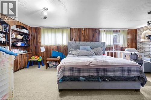LOWER LEVEL REC ROOM CURRENTLY USED BY TENANTS AS A BEDROOM W/FIREPLACE - 591 Mohawk Road W, Hamilton, ON - Indoor Photo Showing Bedroom