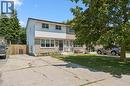Two-story residence featuring light-colored siding and stone veneer accents - 589 Elgin Street N, Cambridge, ON  - Outdoor 