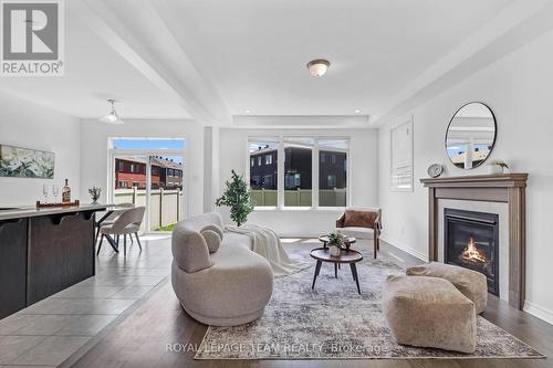 4852 Abbott Street E, Ottawa, ON - Indoor Photo Showing Living Room With Fireplace