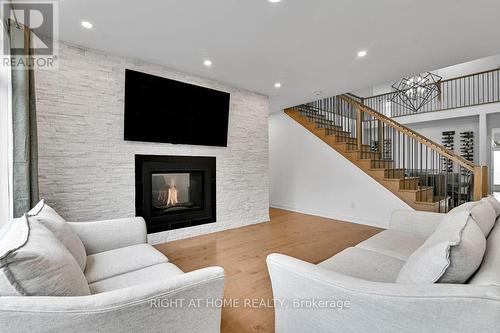 32 Edenbridge Court, Ottawa, ON - Indoor Photo Showing Living Room With Fireplace