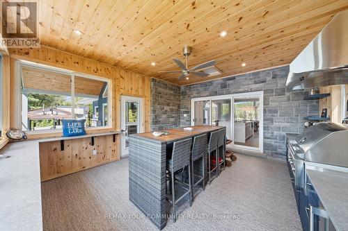 142 Bentley Lake Loop, Faraday, ON - Indoor Photo Showing Other Room With Fireplace