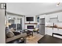 20 Kettle View Road Unit# 206, Big White, BC  - Indoor Photo Showing Kitchen With Fireplace With Stainless Steel Kitchen 
