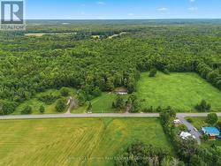 Cleared acreage to the right of house. - 