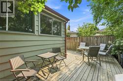 Wood deck area with a privacy fence and exterior siding - 