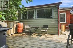 Rear wood deck with horizontal planks - 