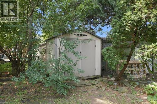 Outdoor storage shed featuring double doors and an upper transom window - 58 Edinburgh Avenue, Hamilton, ON - Outdoor