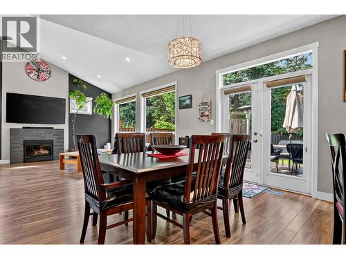 7557 Loedel Crescent, Prince George, BC - Indoor Photo Showing Dining Room With Fireplace