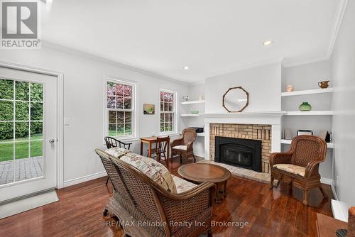Gas fireplace in family room - 60 Tuyll Street, Bluewater (Bayfield), ON - Indoor Photo Showing Living Room With Fireplace