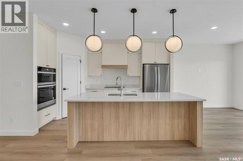 10 720 Brighton Boulevard, Saskatoon, SK - Indoor Photo Showing Kitchen With Upgraded Kitchen