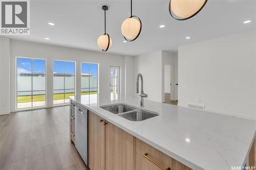 10 720 Brighton Boulevard, Saskatoon, SK - Indoor Photo Showing Kitchen With Double Sink