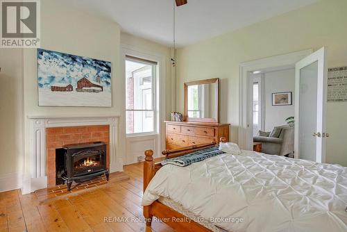 733 County Rd 2 Rd Road E, Otonabee-South Monaghan, ON - Indoor Photo Showing Bedroom With Fireplace