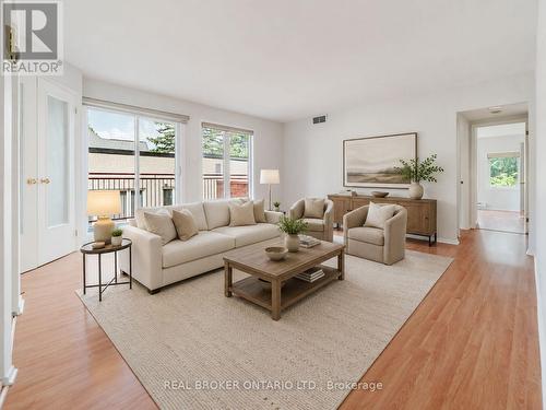 Photo Virtually Staged & Enhanced - 10 - 405 Laurier Avenue E, Ottawa, ON - Indoor Photo Showing Living Room