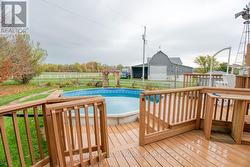 back deck area off kitchen to pool and its covered - 