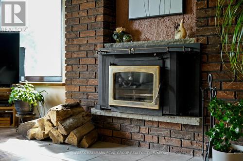 9950 Danforth Road E, Alnwick/Haldimand, ON - Indoor Photo Showing Other Room With Fireplace