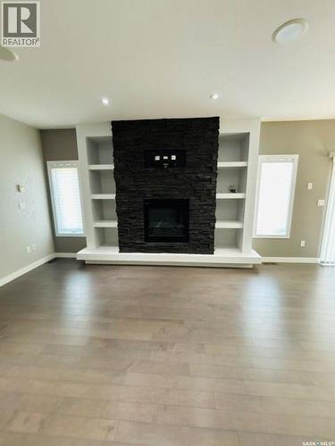 411 Flynn Lane, Saskatoon, SK - Indoor Photo Showing Living Room With Fireplace