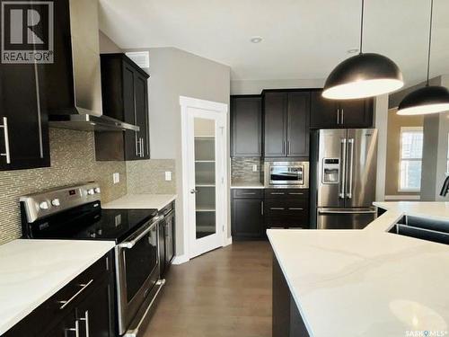 411 Flynn Lane, Saskatoon, SK - Indoor Photo Showing Kitchen With Double Sink With Upgraded Kitchen