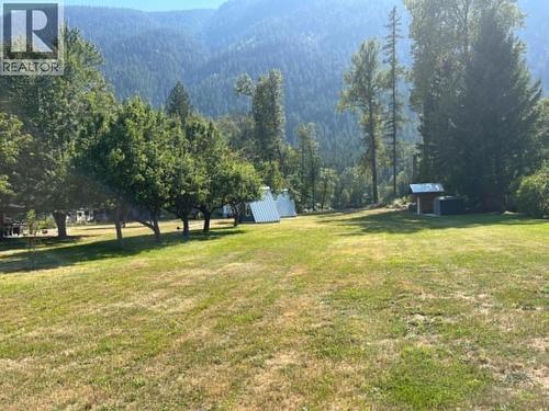 View from the top of the lot towards the water.  First 1/3 of the property has been left open for future build site. - 3045 Bower Road, Slocan Park, BC 
