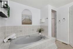 Built-in tub with tile surround and deck-mounted faucet - 