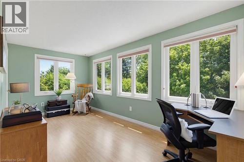 Spacious room featuring light green walls, and multiple large windows with white trim - 2188 Bader Crescent, Burlington, ON - Indoor Photo Showing Office
