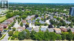 Residential neighborhood featuring tree-lined streets and detached homes - 