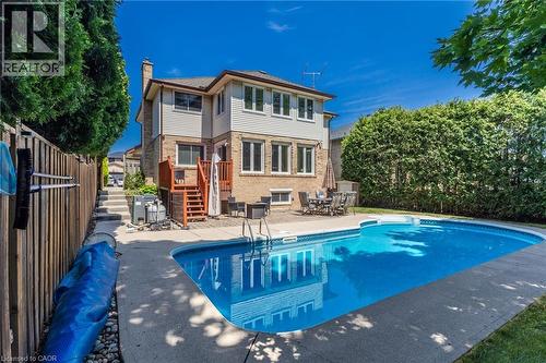 Rear yard view of property with pool - 2188 Bader Crescent, Burlington, ON - Outdoor With In Ground Pool