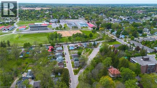 Aerial perspective of a residential area featuring established homes and verdant landscapes - 9 James Street, Simcoe, ON 